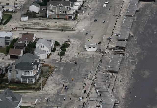 A building sits in the middle of the road in Belmar, N.J.